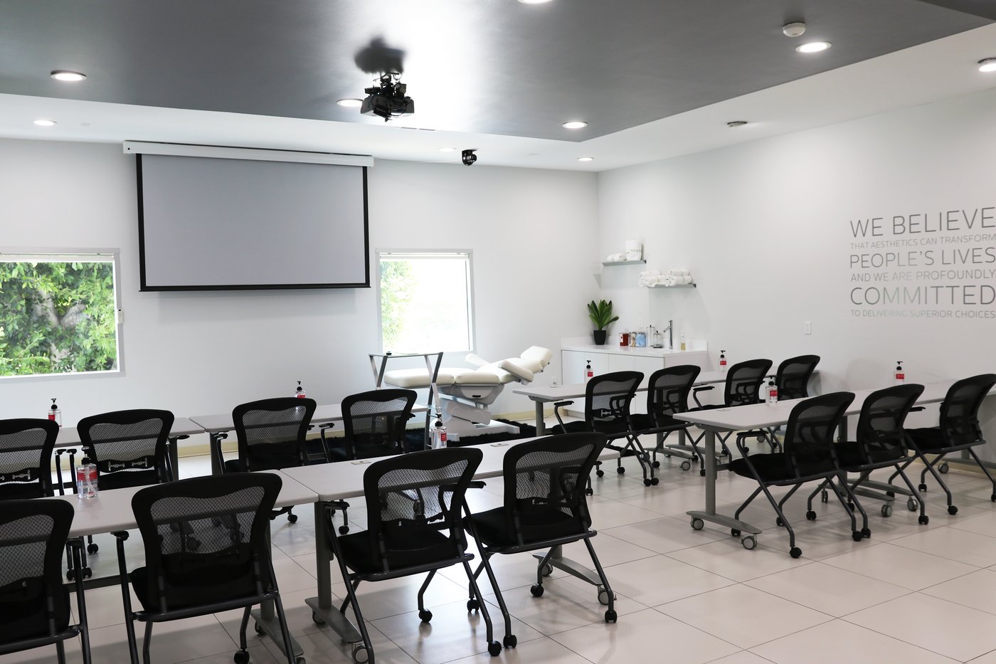 Empty classroom set up with adjustable medical bed at front