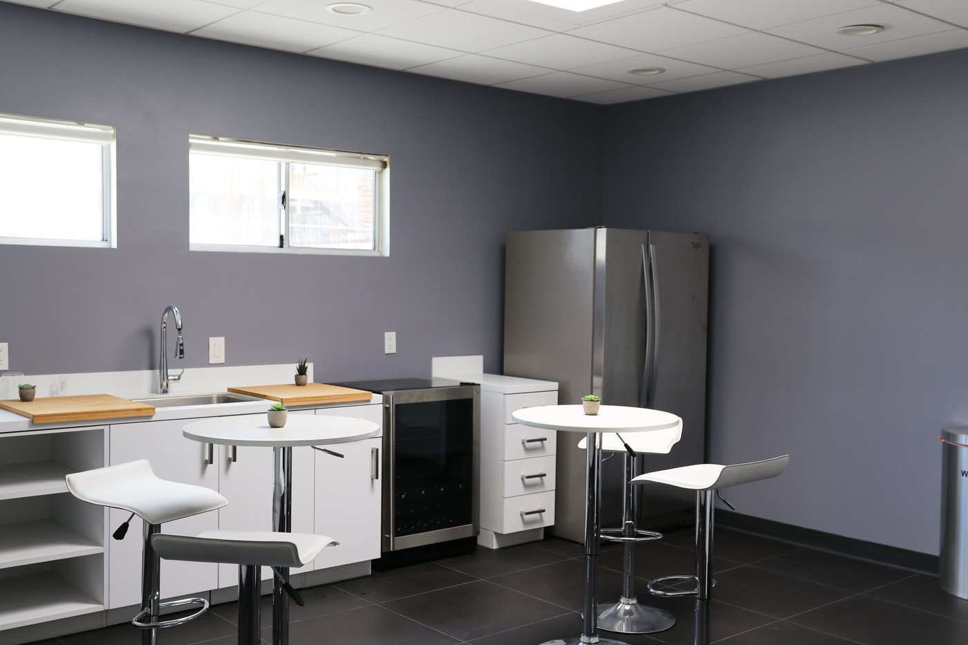 Catering kitchen with refrigerator and bar seating